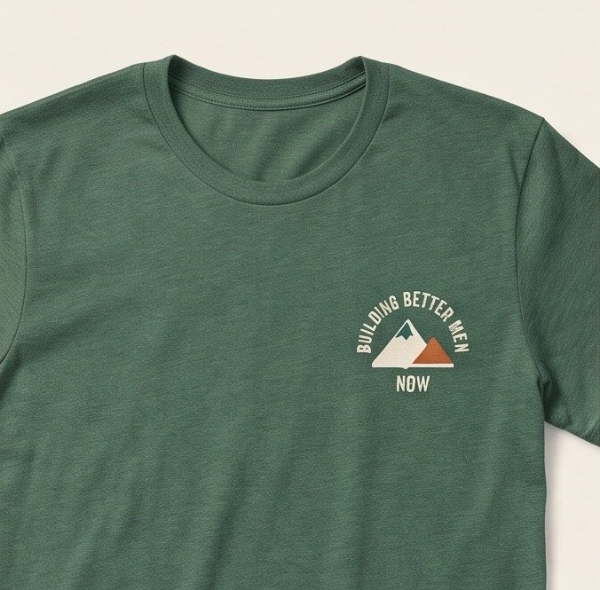 Pine green t-shirt with the Building Better Men Now badge on the left chest